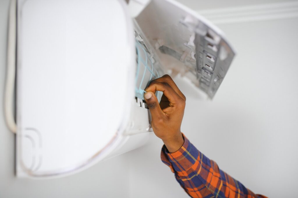 AC Electrician Technician Repairing Air Conditioner Appliance